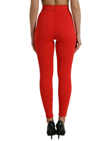 Red nylon stretch slim leggings pants by Dolce & Gabbana displayed on a model, showcasing a fitted, sleek design.