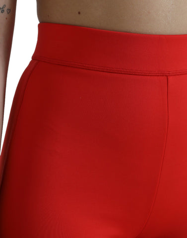 Red nylon stretch slim leggings pants by Dolce & Gabbana, close-up of fitted, smooth fabric and sleek design.