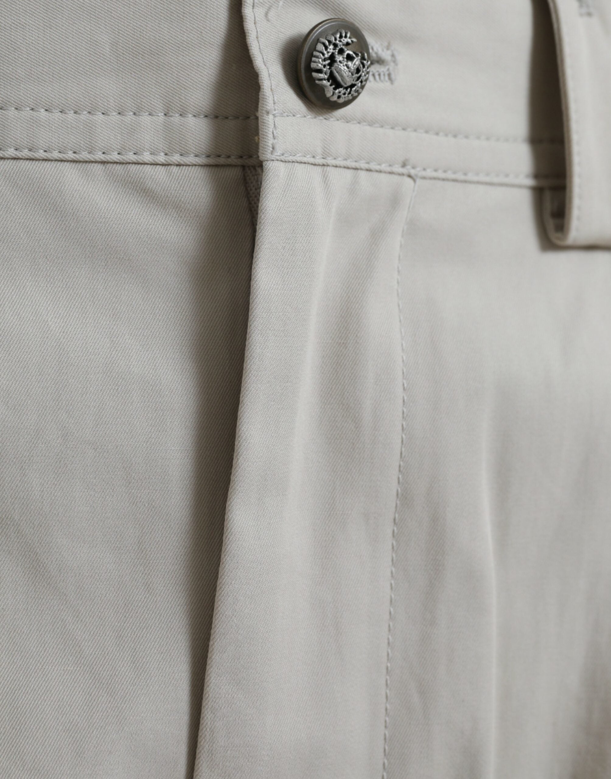 Beige Dolce & Gabbana cotton high waist tapered pants, front view showing tailored fit and clean design.