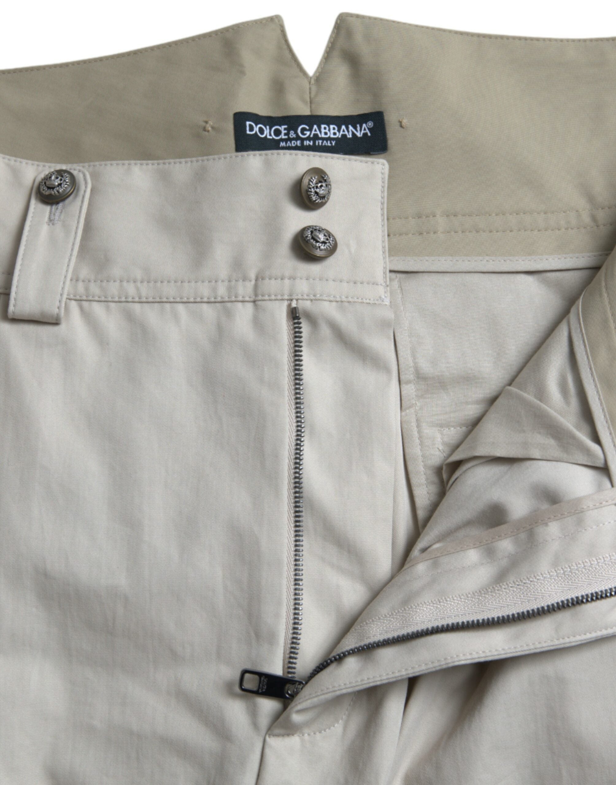 Beige cotton high waist tapered pants by Dolce & Gabbana, shown on a model with front and side view.