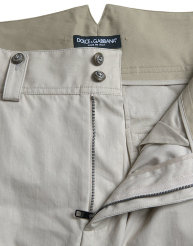 Beige cotton high waist tapered pants by Dolce & Gabbana, shown on a model with front and side view.