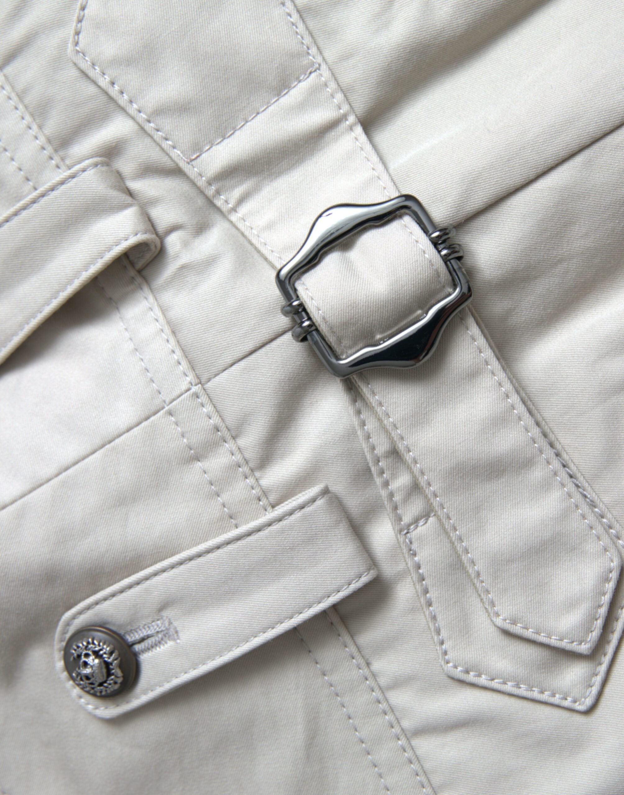 Beige cotton high waist tapered pants by Dolce & Gabbana, showing the relaxed fit and tailored design on a model.