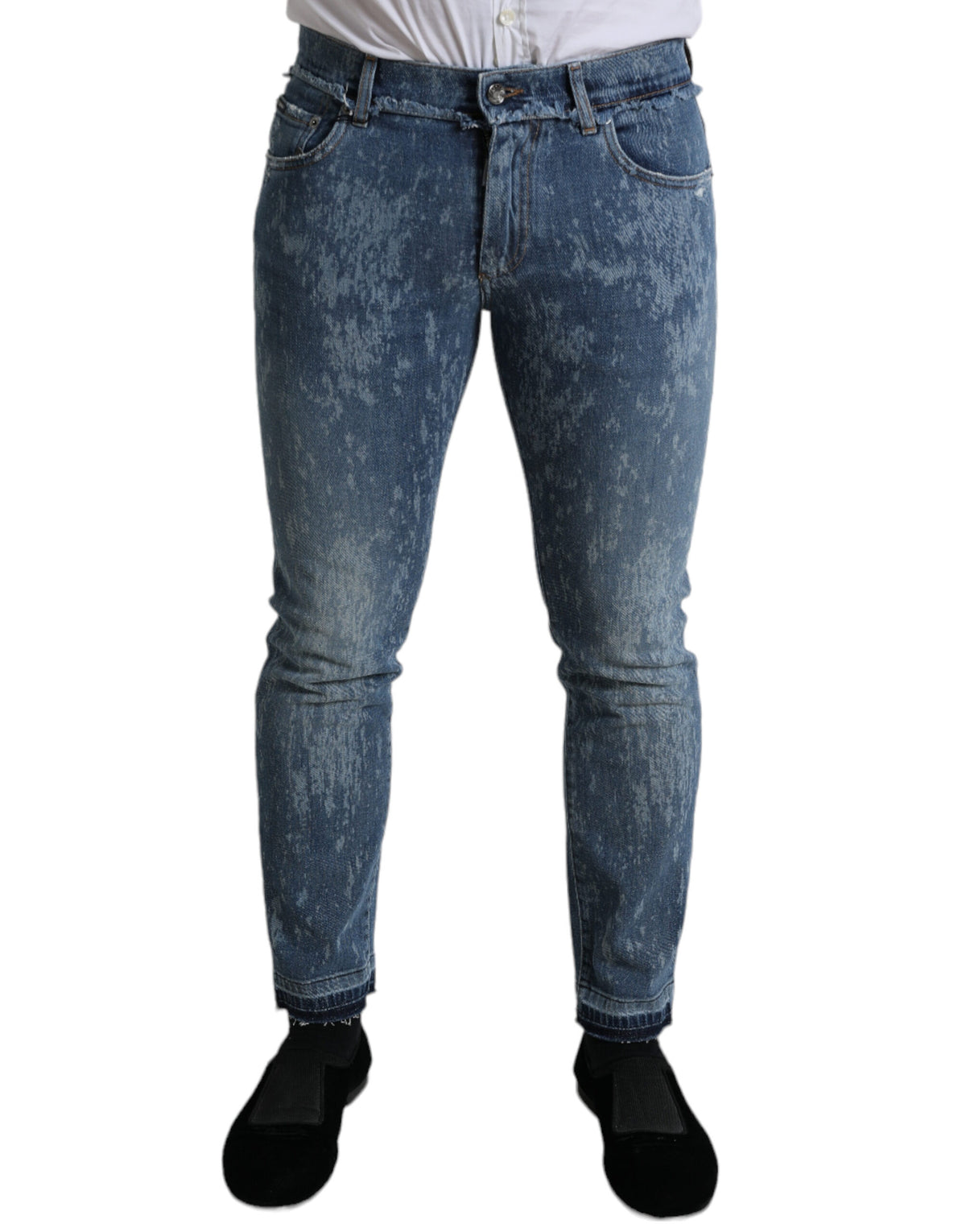 Blue washed skinny cotton stretch denim jeans by Dolce & Gabbana hanging on a rack.