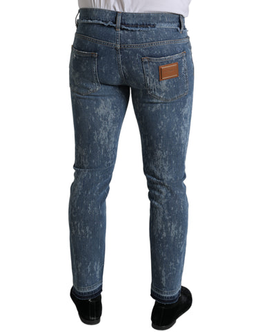 Blue washed skinny cotton stretch denim jeans by Dolce & Gabbana, close-up of fitted denim fabric and design details.