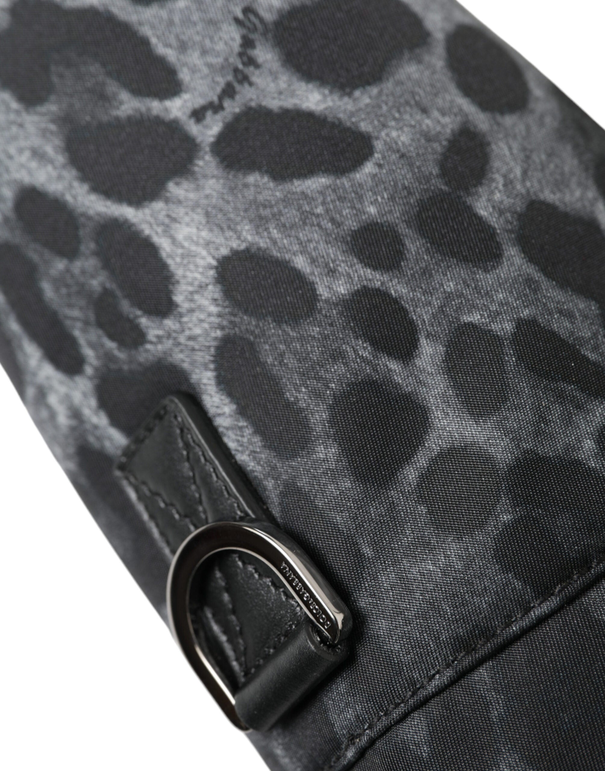 Black leopard print Dolce & Gabbana round slim tote bottle cage bag with top handle and compact design.