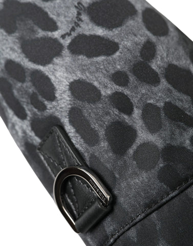Black leopard print Dolce & Gabbana round slim tote bottle cage bag with top handle and compact design.