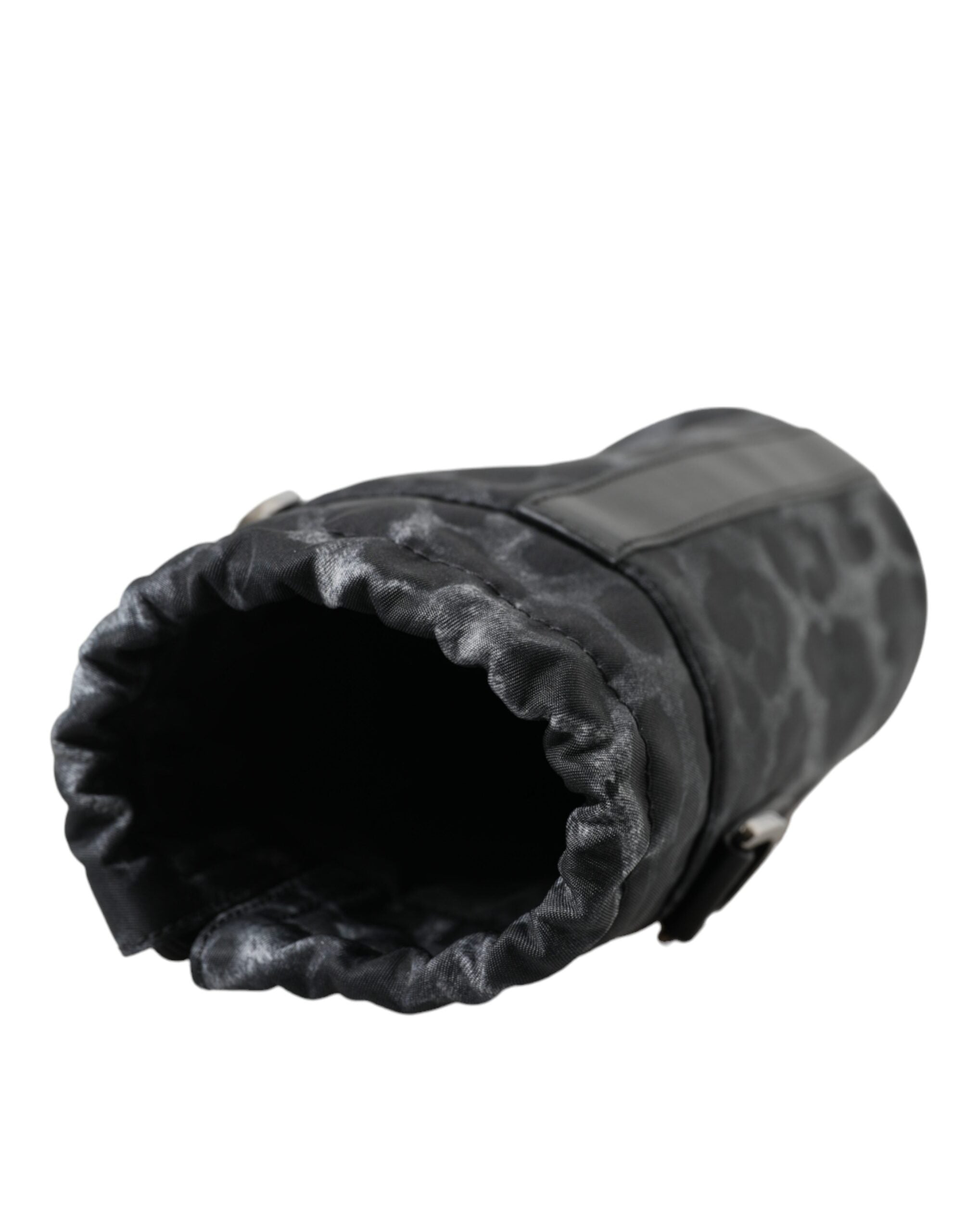 Black leopard print round slim tote bottle cage bag by Dolce & Gabbana with adjustable strap and compact design.