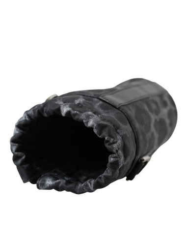 Black leopard print round slim tote bottle cage bag by Dolce & Gabbana with adjustable strap and compact design.
