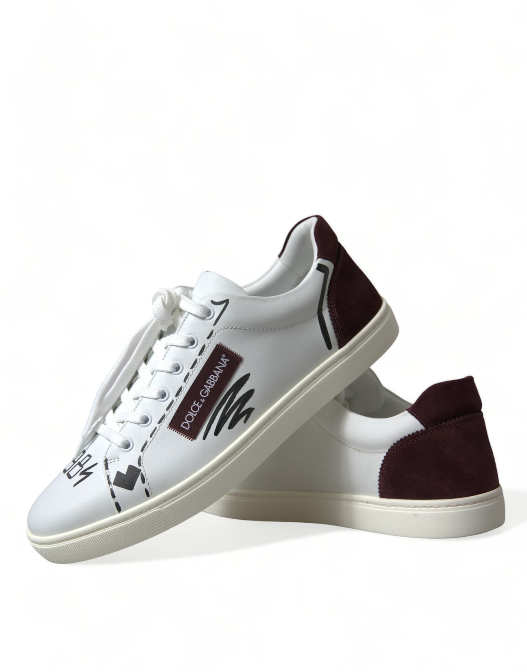 White Bordeaux leather low top sneakers by Dolce & Gabbana with logo detail, featuring a sleek casual design and comfortable fit.