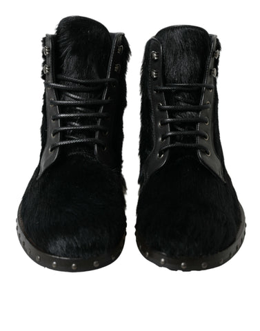 Black pony style leather mid calf boots by Dolce & Gabbana, showcasing sleek design and stylish ankle-high footwear.