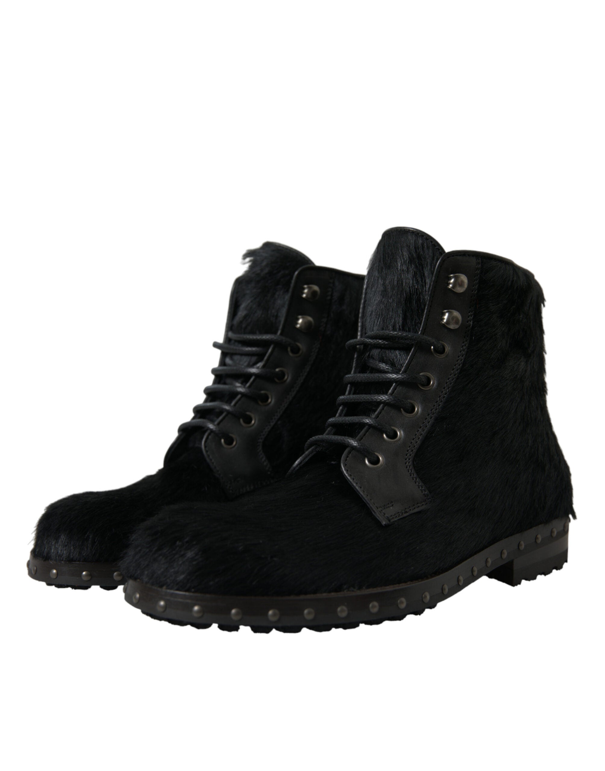 Black pony style leather mid-calf boots by Dolce & Gabbana, featuring sleek design and classic silhouette.