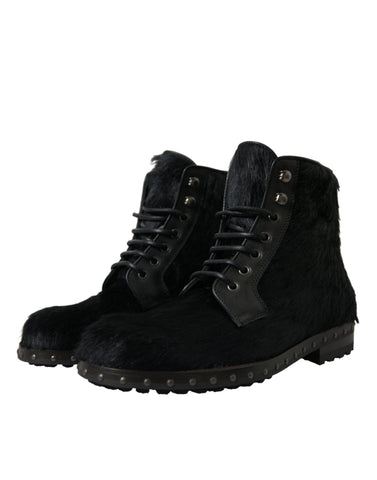 Black pony style leather mid-calf boots by Dolce & Gabbana, featuring sleek design and classic silhouette.