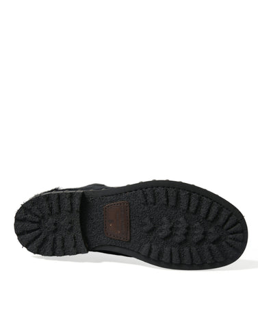 Black pony style leather mid-calf boots by Dolce & Gabbana, featuring sleek design and classic knee-high silhouette.