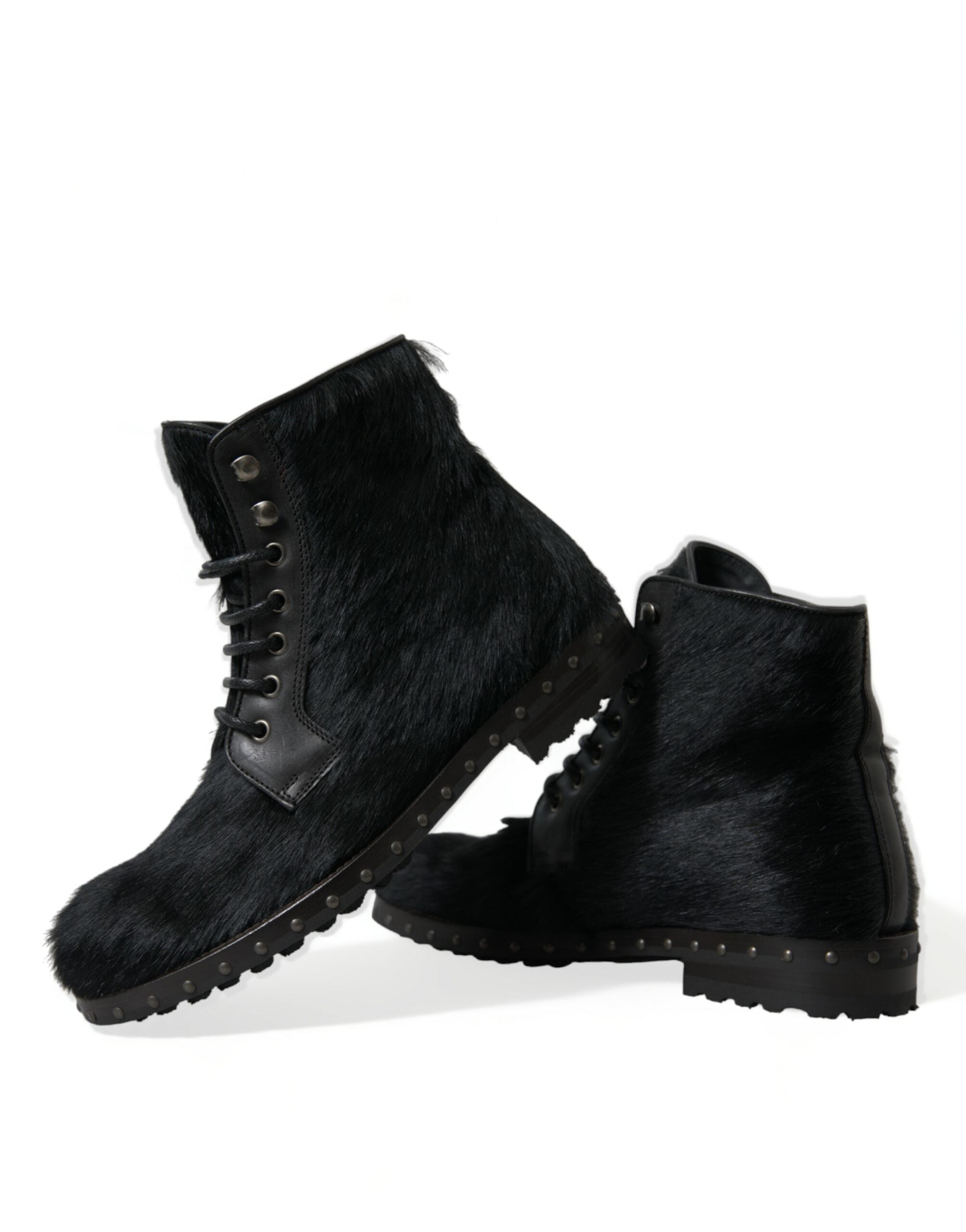 Black pony style leather mid-calf boots by Dolce & Gabbana, featuring sleek design and pointed toe, perfect for stylish fall outfits.