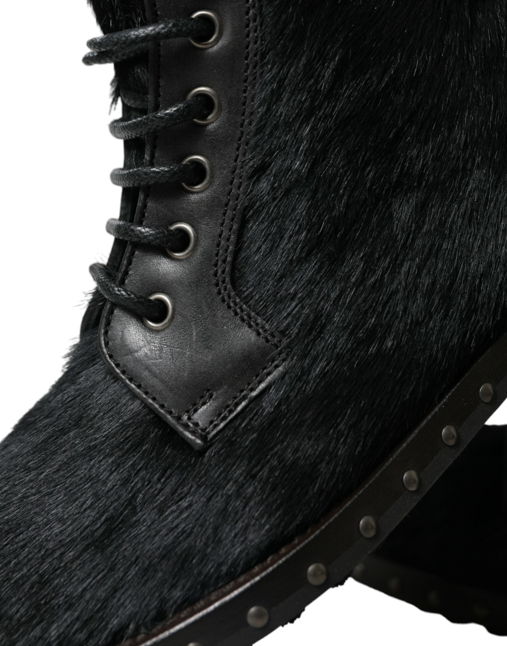 Black pony style leather mid-calf boots by Dolce & Gabbana, showcasing sleek design and pointed toe with chunky heel.
