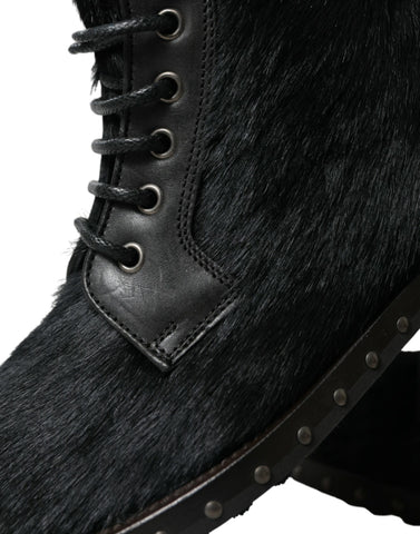 Black pony style leather mid-calf boots by Dolce & Gabbana, showcasing sleek design and pointed toe with chunky heel.
