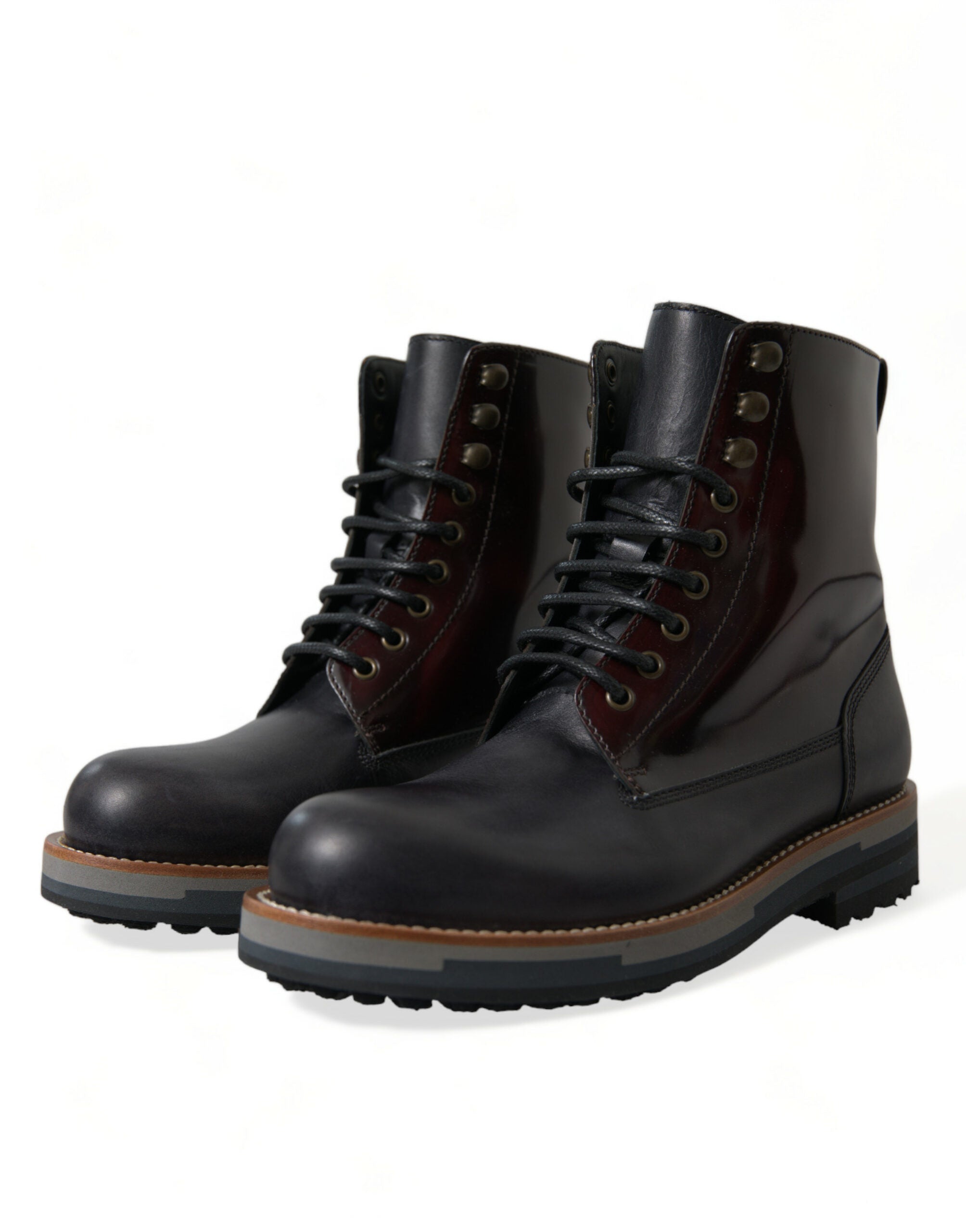 Black leather military combat boots by Dolce & Gabbana, featuring rugged design and lace-up style on a plain background.