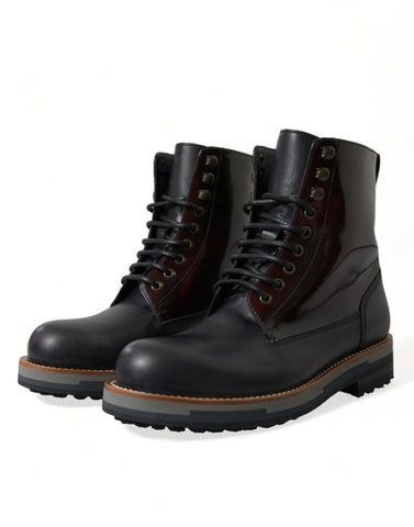 Black leather military combat boots by Dolce & Gabbana, featuring rugged design and lace-up style on a plain background.