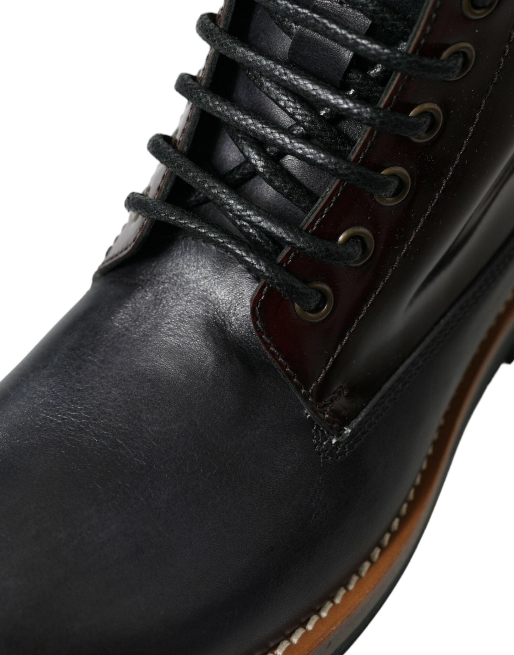 Black leather military combat boots by Dolce & Gabbana, featuring sturdy design and lace-up detail for rugged style.