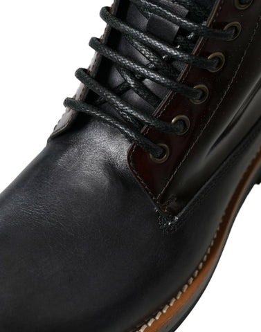 Black leather military combat boots by Dolce & Gabbana, featuring sturdy design and lace-up detail for rugged style.