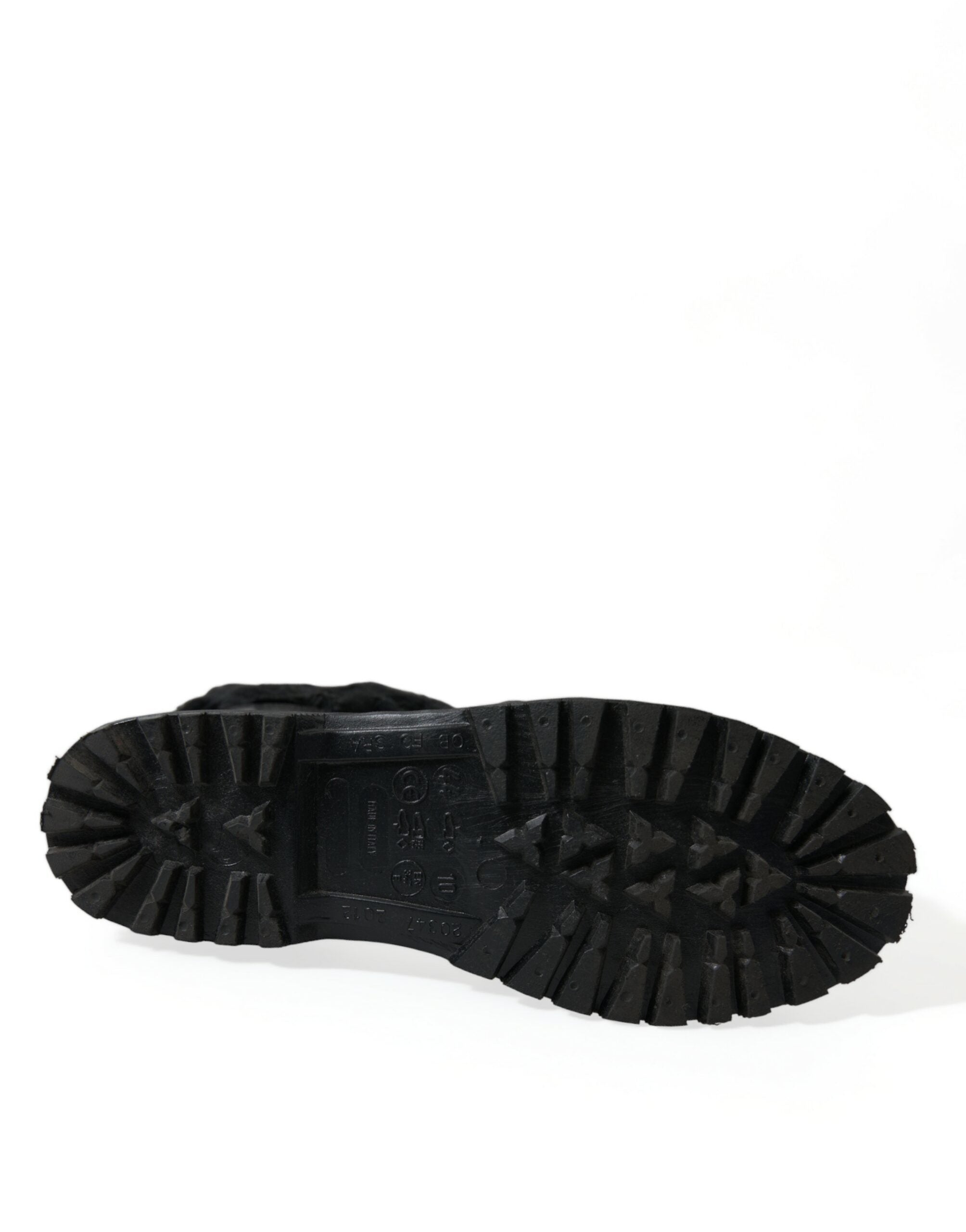Black rubber lace-up shearling rain boots by Dolce & Gabbana, featuring sturdy soles and cozy shearling lining.