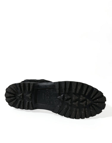 Black rubber lace-up shearling rain boots by Dolce & Gabbana, featuring sturdy soles and cozy shearling lining.