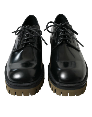 Black leather lace-up derby dress shoes for men by Dolce & Gabbana, featuring polished leather and classic design.