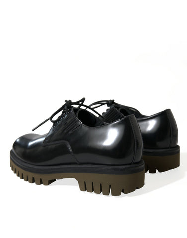 Black leather lace-up derby dress shoes for men by Dolce & Gabbana, featuring sleek design and polished finish.