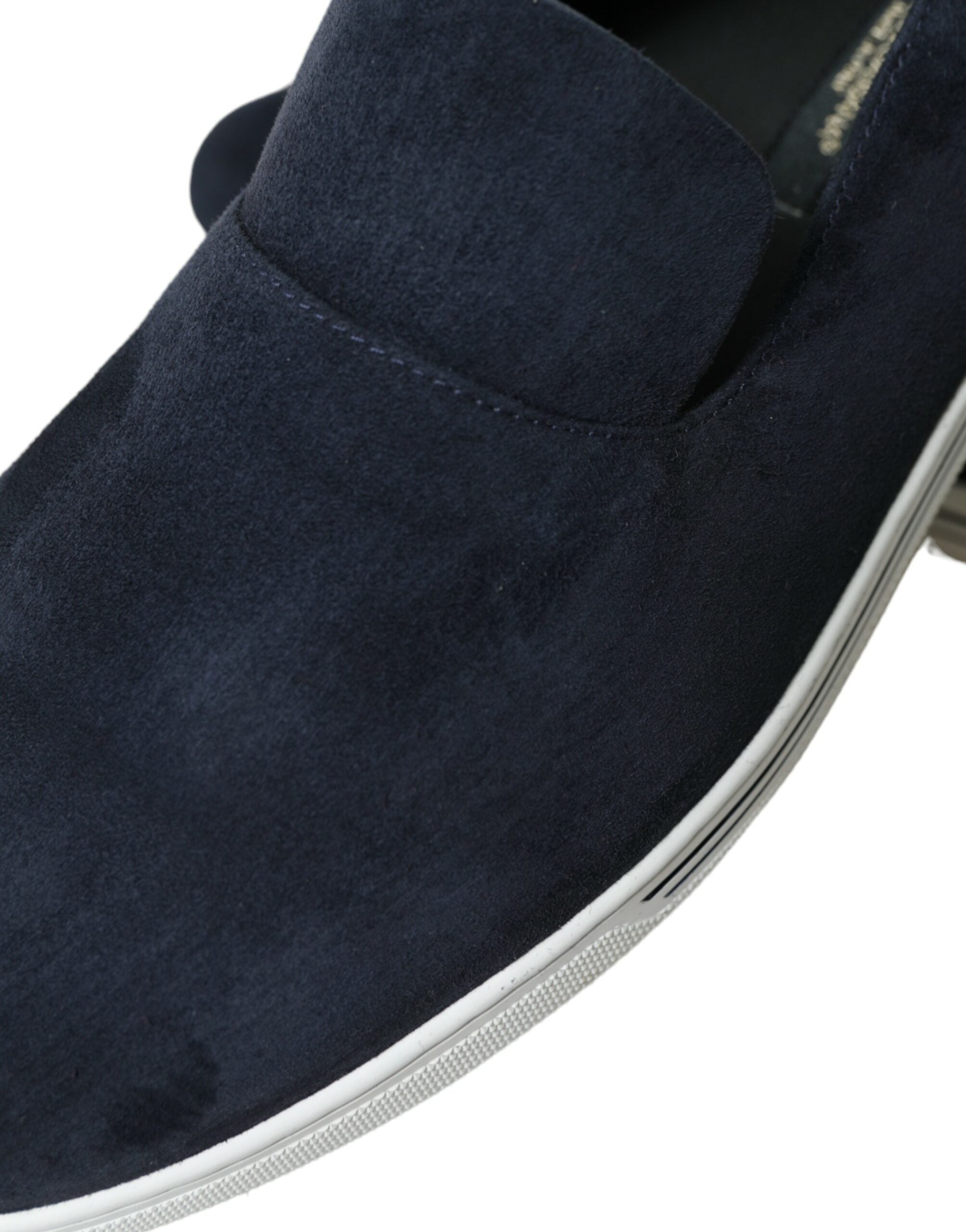Blue suede Caiman loafers by Dolce & Gabbana featuring classic slip-on style and elegant design on a neutral background.