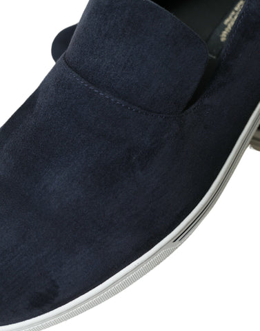 Blue suede Caiman loafers by Dolce & Gabbana featuring classic slip-on style and elegant design on a neutral background.