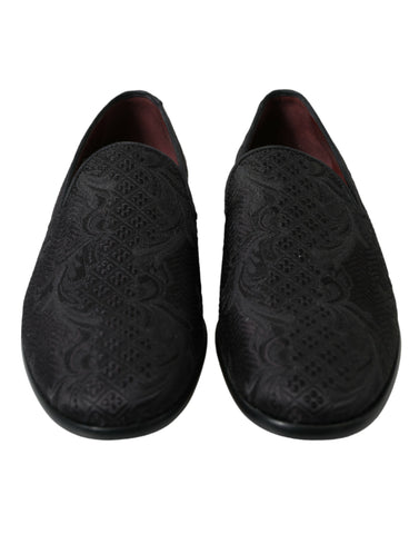 Black brocade men's slip-on loafers by Dolce & Gabbana, featuring elegant dress shoe design with intricate fabric detail.