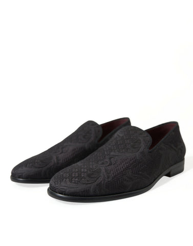 Black brocade men slip-on loafer dress shoes by Dolce & Gabbana with a stylish, textured design and sleek slip-on style.