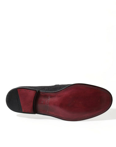 Dolce & Gabbana black brocade slip-on loafer dress shoes for men, stylish and elegant with intricate fabric detail.