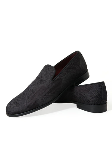 Black brocade men's slip-on loafer dress shoe by Dolce & Gabbana on a white background