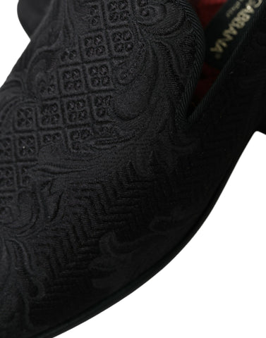 Black brocade men's slip-on loafer dress shoes by Dolce & Gabbana, featuring elegant fabric and classic silhouette.
