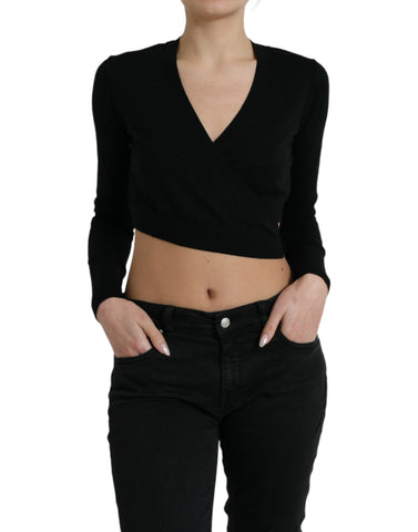 Black wool V-neck crossed cardigan sweater by Dolce & Gabbana displayed on a hanger with detailed knit texture.