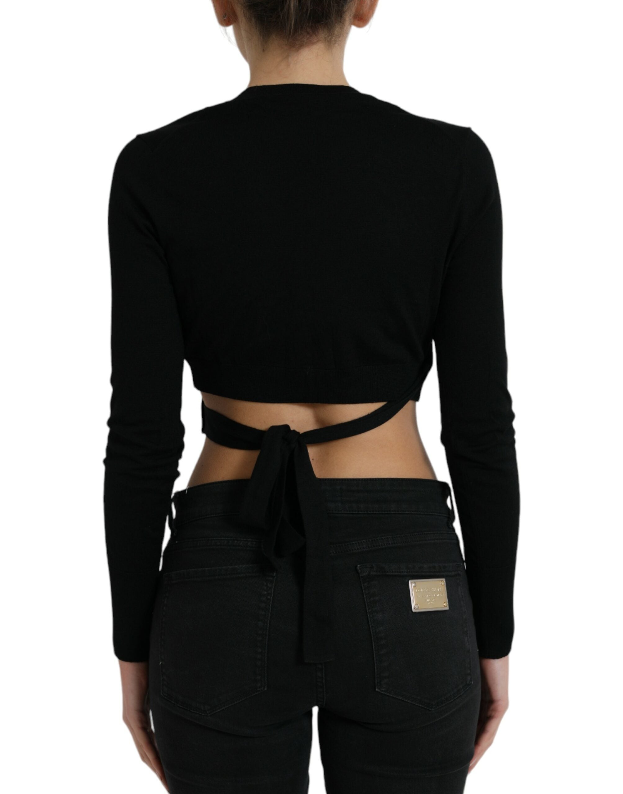 Black wool V-neck cardigan sweater with crossed front design by Dolce & Gabbana, displayed on a neutral background.