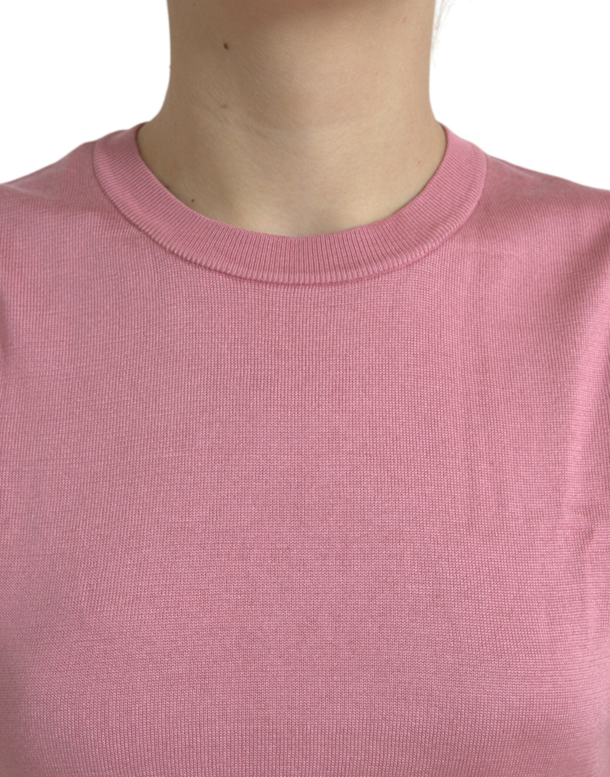 Pink Dolce & Gabbana cropped sleeveless tank top with a crew neck, featuring a fitted design and smooth fabric.