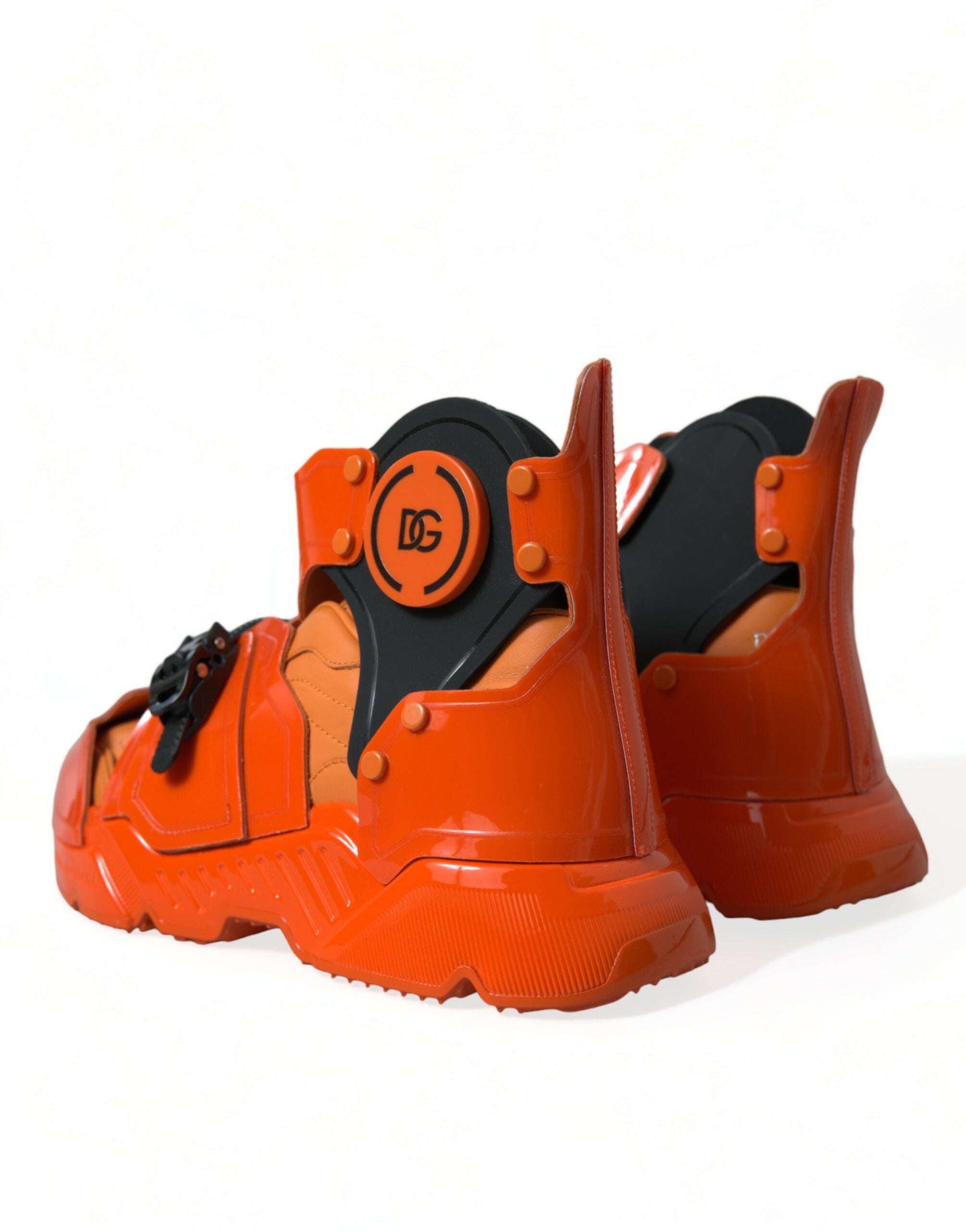 Orange multi-panel chunky high top sneakers by Dolce & Gabbana with bold design and textured soles.
