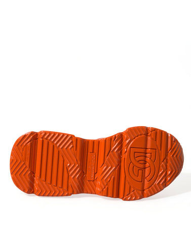Orange multi-panel chunky high-top sneakers by Dolce & Gabbana, featuring bold design and thick rubber soles.