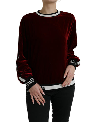 Dolce & Gabbana Bordeaux velvet round neck pullover sweater, close-up of rich red fabric and soft texture.