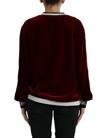 Dolce & Gabbana Bordeaux velvet round neck pullover sweater with long sleeves and a soft, luxurious texture.