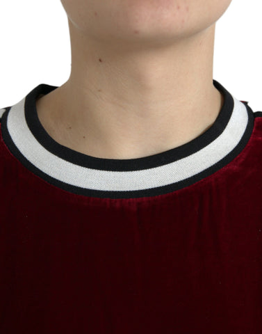 Dolce & Gabbana Bordeaux velvet round neck pullover sweater showing its soft fabric and classic fit.