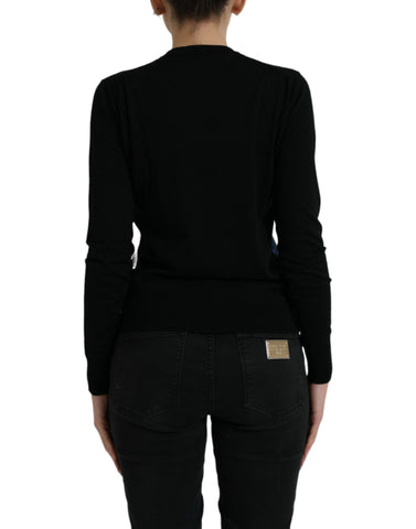 Black bird wool long sleeve cardigan sweater by Dolce & Gabbana, featuring a bird pattern and button closure.