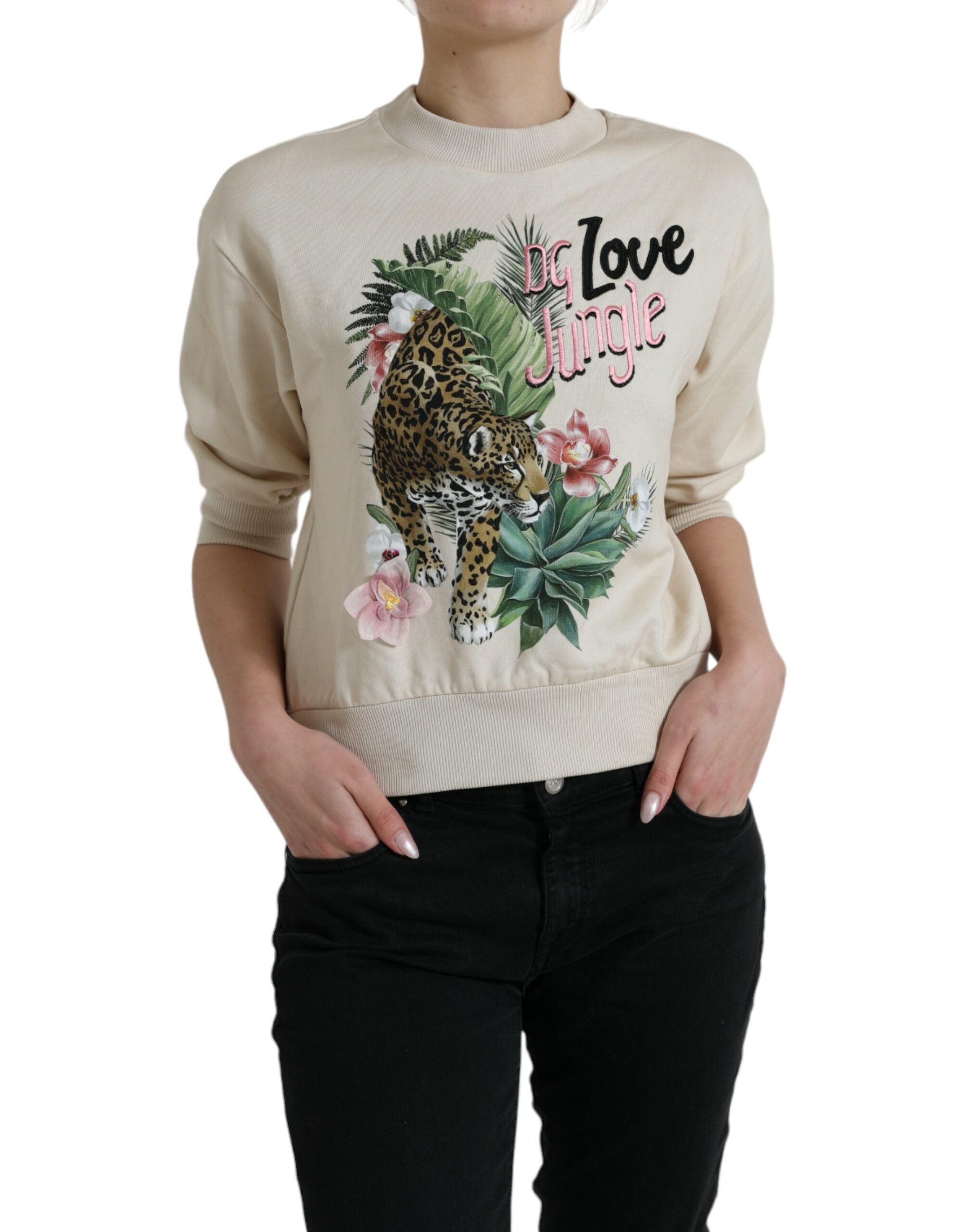Beige jungle printed cotton pullover sweater by Dolce & Gabbana with bold tropical foliage design.