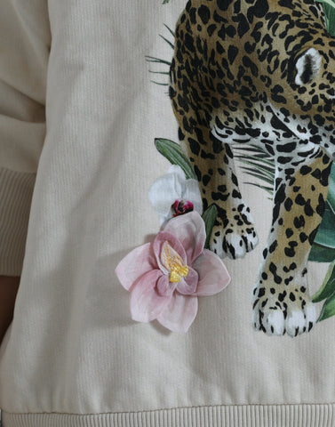 Beige jungle printed cotton pullover sweater by Dolce & Gabbana featuring a relaxed fit and vibrant jungle motif.