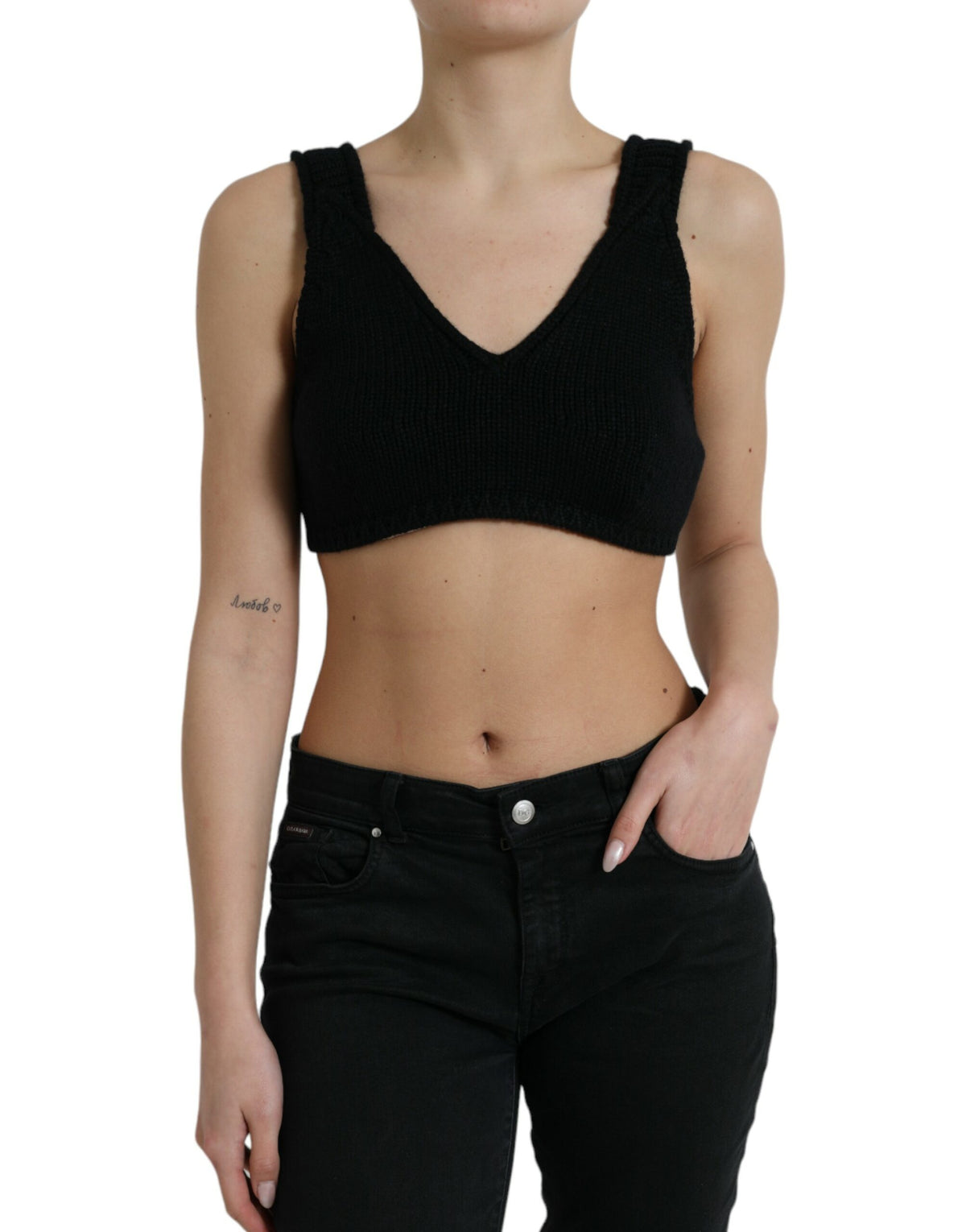 Black cropped cashmere V-neck bustier top by Dolce & Gabbana, shown with a fitted, soft-textured design and V-shaped neckline.