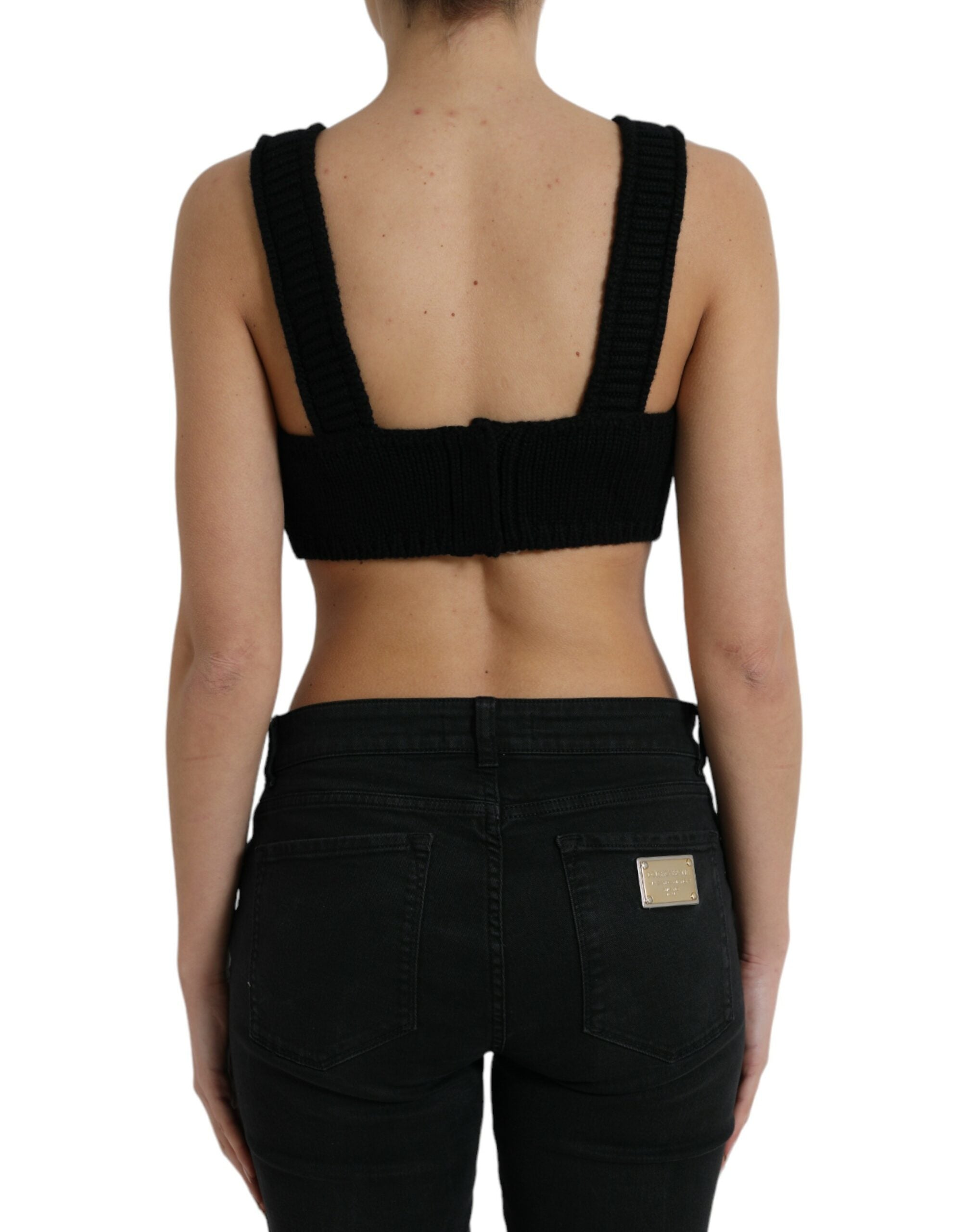 Black cropped cashmere V-neck bustier top by Dolce & Gabbana, shown on a mannequin, highlighting its soft texture and fitted style.