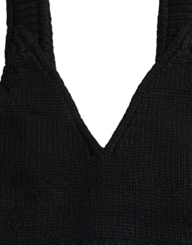 Black cropped cashmere V-neck bustier top by Dolce & Gabbana, shown on a model with close-up of fabric and neckline details.