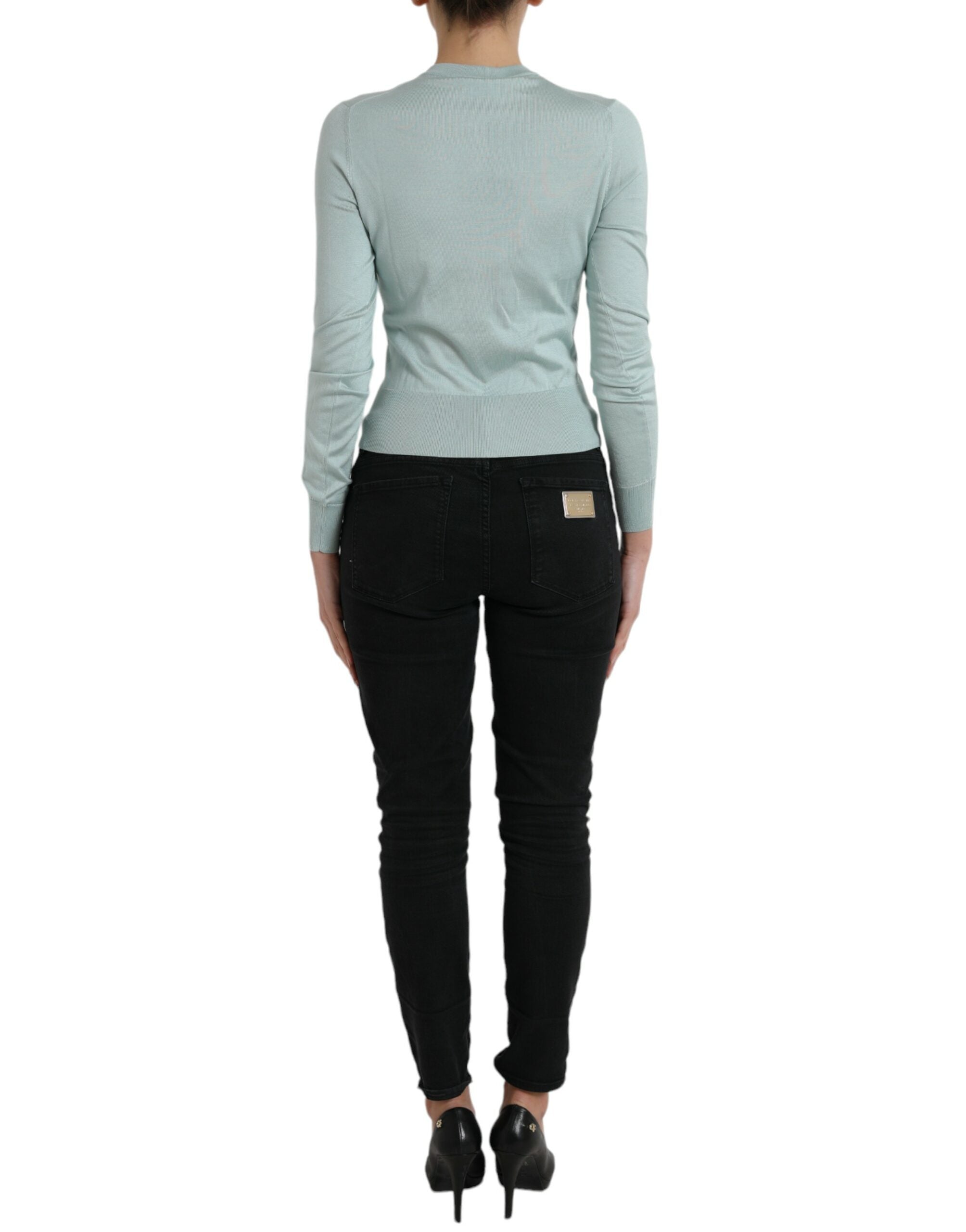 Light blue silk crew neck cardigan sweater by Dolce & Gabbana, displayed on a mannequin.